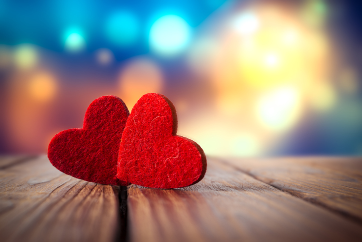 Valentines day. Red hearts on wooden background