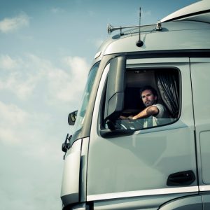 Truck Driver Sitting In Cab