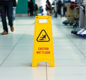 wet floor sign in the middle of a crowded area
