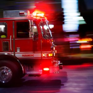 A fire engine races to the scene of an emergency.