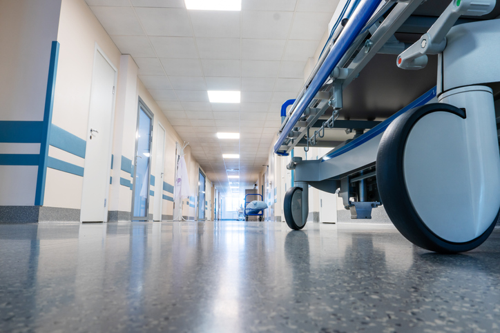 View of hospital wheels of a hospital bed in a hallway.