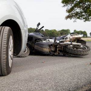 A car and motorbike in an accident